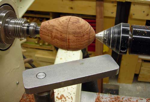 A bubinga rocket that's been finish-turned but not yet sanded.